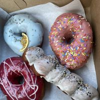 Donut choices. Lavender, strawberry, sausage stuffed, and raspberry. at Sojo's Donuts in Mesa