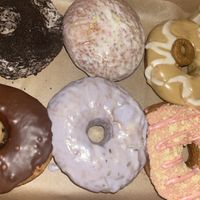 Cookies n cream, vanilla glaze, gingerbread, cookie dough, lavender lemon, strawberry shortcake   at Sojo's Donuts in Mesa