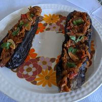 Traditional Albanian eggplant stuffed with tomatoes, peppers, onions and garlic.  at Taverna Tradicionale in Gjirokaster