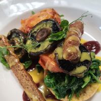 Hashbrowns topped with spinach, tomato, sage sausage and sauce hollandaise at The Offering in Greytown