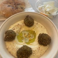 Falafel-hummus bowl with pickled veggies and pita bread  at Levantini in Maastricht