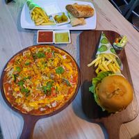 Tacis pizza, double cheese pizza and chick n shawarma all plant based protien at Just Vegan - Marina Walk Pearl in Dubai
