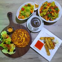 Spanish Omlette, spring rolls, wild mushrooms soup, orange avicado salad and loaded Nachos all vegan with olant based protein  at Just Vegan - Marina Walk Pearl in Dubai