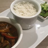 Soy meat gulasch, rice and green leaf veggies  at Just Vegan - Marina Walk Pearl in Dubai