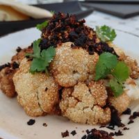 Crisp Cauliflower with salsa Matcha, tahini and cilantro at Fatima 7 Rooftop in San Miguel De Allende