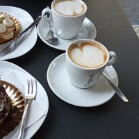 Custard and pistaccio cake (top), dark chocolate, cream and cherry cake (bottom) and coffee. at efrem in Turin