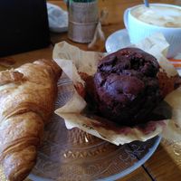 Croissant, chocolate muffin and coffee with oat milk at Hemen Cafeteria in Arrasate