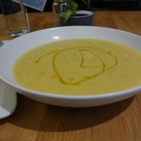 Vegan yellow carrot and leek soup at Holis Market in Vienna