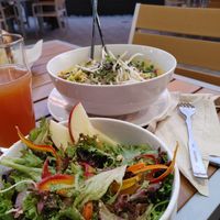 Local T & V Greens salad, curry bowl and a cider.  at Tap & Vine at 559 in Medford