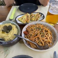Vegan fava “married” dip and garlic and tomato pasta (skordomakarona)  at Pelican Kipos in Santorini