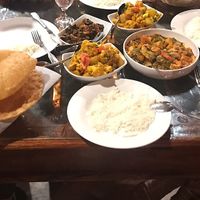 Aloo Ghobi, tofu jhalfrezi, Bhindi do Pyaza, roti and poori at India Palace in Nashua