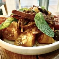 Tomato salad, mint, red onion and olives with paprika vinaigrette and pitta crisps. Who thought a tomato salad could be this good!  at ZA ZA TA in Fortitude Valley