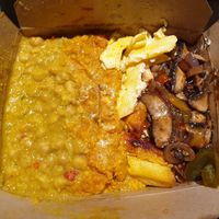 Chickpea curry, mushrooms, macaroni pie and pumpkin. at Eat of Eden in South West London