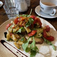 toast with hummus, avocado, rocket, tomatoes and courgette and oat cappuccino   at Café Lebenslust in Rothenburg Ob Der Tauber