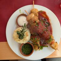 Smokey tofu-veggie skewers, tomato sauce, mashed potato and two different homemade dips at Marie e Oli's in Armacao De Pera