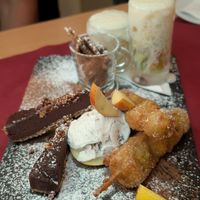 dessert combo: deep-fried fruit skewers, coconut icecream, chocolate tarte, spelt crackers, fruit with a lemony soy-foam at Marie e Oli's in Armacao De Pera