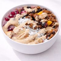 Berry granola smoothie bowl | high-protein | dairy-free | made with berries, banana, house plant milk, granola, fruits & peanut butter. at Tralata in Mumbai