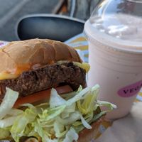 Vegan cheeseburger and orange vegan milkshake!  at Burger Crush in Victoria