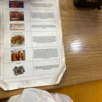 Ingredient info sheet taped to ordering counter

 at Slutty Vegan - Edgewood in Atlanta