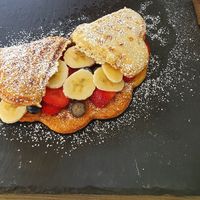 Vegan waffle with fruit and powdered sugar at Dalina's in Gaggenau