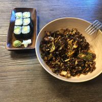 Crispy Brussels sprouts and mini avocado roll. at Kitchen 121 in Duluth