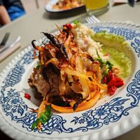 MoMos : Charred white cabbage with walnut oil, cauliflower and chickpea msabbaha with tahini, sunflower crumble and sourdough bread, green sauce and goji berries at Café Augustin in Rouen