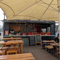 Cosy, little stand in front of the shop toom at Rockwurst in Leipzig