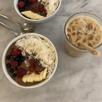 Açai and choco bowl with oat ice coffee   at Love Juice Bar - Grenelle in Paris