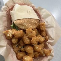 Spicy chicken sandwich and tater tots    at Nice Burger - Santa Ana in Santa Ana