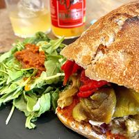 “Chapata pura vida” Sandwich and carrot/turmeric kombucha.  at Santa y Pura in Madrid
