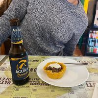 Tapapies 2023: Corn flour casing filled with meat and topped with a creamy white sauce. at Santa y Pura in Madrid