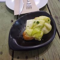 Bread with sliced marinated leeks (I think), Santa y Pura, 7 November 2024 at Santa y Pura in Madrid