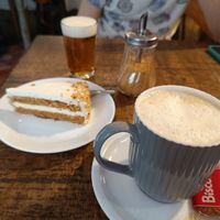 Café con leche de avena y tarta de zanahoria at Santa y Pura in Madrid