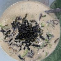 Acorn sujebi in a perilla seed broth. Also contains potato, seaweed, spring onion, courgette, and green chilli that gives the stew a bit of a kick!  at Nanulteo - 나눌터 in Suncheon