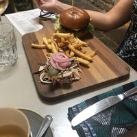 Burger on a massive board at Harp & Crown in Corsham
