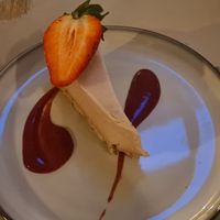 Peanut butter cheesecake with strawberry sauce at Harp & Crown in Corsham
