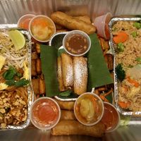 Special vegetarian Christmas tray containing fried rice, pad Thai, fried tofu skewers, egg rolls and caramel apple egg rolls. at Sweet Basil in Franklin