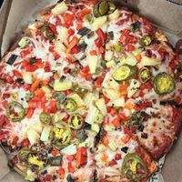 Build-your-own vegan pizza: 9” pan, classic red sauce, vegan cheese, red pepper, green onion, red onion, jalapeño, pineapple, roasted garlic.   at Rapid Fired Pizza in Englewood