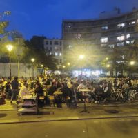 Large seating area across from the restaurant; they will bring your food to you there. at Crêperie le goéland d'Aligre in Paris