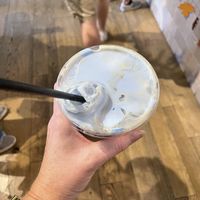 Cold brew with coconut cream and blue spiralina   at Eat Real Cafe in Valencia