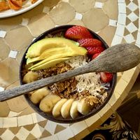 Açaí bowl with avocado  at Eat Real Cafe in Valencia