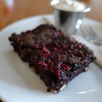 Amazing VEGAN BROWNIE with whipped Cashew cream.  at Cosset in Auckland