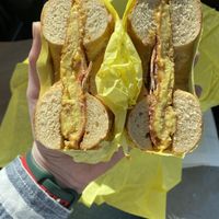 Bacon, egg, and cheese on onion bagel  at Ben & Esther's Vegan Jewish Deli in Portland