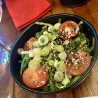 Wakame seaweed salad with spring onions, cherry tomatoes, sesame dressing  at Seven Lucky Gods in Bristol