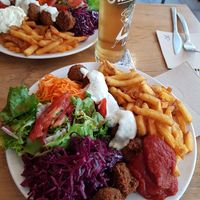 Falafel, fries, fresh salad with yogurt mint sauce at Veggie Bros - Sanderstr in Wurzburg