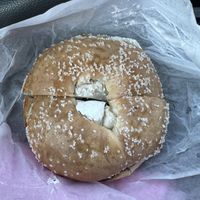 Toasted salt bagel with vegan cream cheesee  at Cella Bagel in Selden