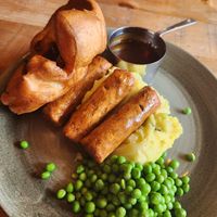 vegan sausages, mesh, peas and gravy at The Dirty Bottles in Alnwick