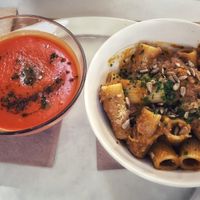 Carrot lemongrass soup and a pumpkin sauce rigatoni at Aguaribay in Barcelona