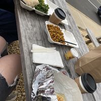 Crunchwraps, home fries, and coffees at their picnic tables outside   at Cats Luck Vegan in Neptune City