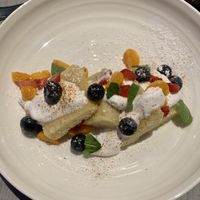 Tres leches cake with seasonal fruit at GuacStar Kitchen and Cantina in Tempe